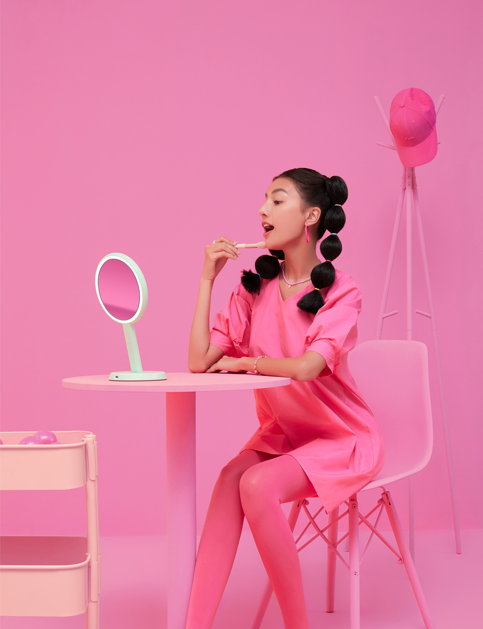 Woman doing makeup with Cami Handheld LED Mirror